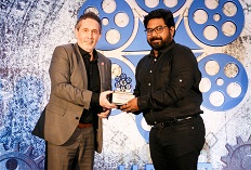 IIFTC Awards - Luke Azevedo, Film Commissioner of Calgary presenting to Sinoy Joseph for And the Oscar Goes to